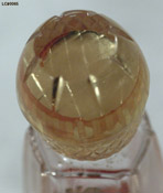 Detail of stopper of Coty's L'Aimant perfume